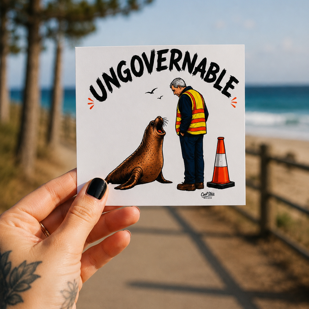 A hand holds a square white Cool Shiz, Neil the seal, Ungovernable, waterproof, scratch resistant, vinyl sticker.
